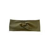 Green headband with a knot on a white background