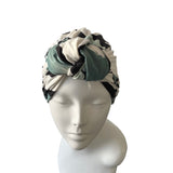 Turban with a pattern on a mannequin head against a white background