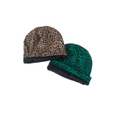 Two leopard print beanies with green and brown patterns on a white background