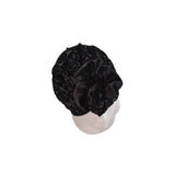 Black floral headscarf on a mannequin head against a white background
