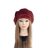 Mannequin head with a brown turban on a white background