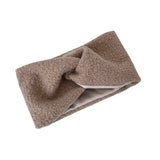 Brown fabric headband with a textured pattern on a white background