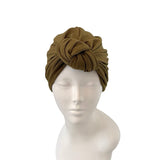 Brown headscarf on a mannequin head against a white background