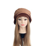 Mannequin head with a brown beanie on a white background