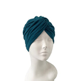 Blue headscarf on a mannequin head against a white background