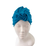 Blue headscarf on a mannequin head against a white background