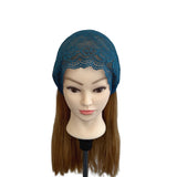 Mannequin head with blue lace headband on a white background