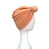 Shiny blush pink and gold metallic fabric turban hat for women. This is a soft and stretchy double-layer design metallic jersey turban hat.
