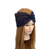 Navy lace headband on a mannequin head with long brown hair against a white background