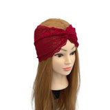Red lace headband on a mannequin head with long brown hair against a white background