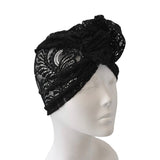 Black lace headband on a mannequin head against a white background