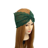 Green lace headband on a mannequin head with brown hair against a white background