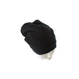 Black knit beanie on a white background