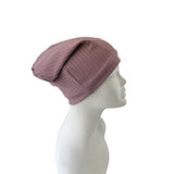 Mauve headscarf on a mannequin head against a white background