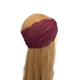 Maroon lace headband on a mannequin head with blonde hair against a white background