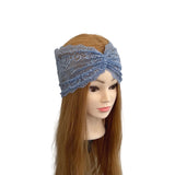 Blue lace headband on a mannequin head with long brown hair against a white background