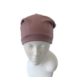 Brown beanie on a mannequin head against a white background