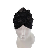 Black headscarf on a mannequin head against a white background