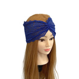 Mannequin head with blue lace headband on a white background