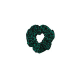 Green leopard print scrunchie on a white background