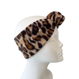 Leopard print headband on a mannequin head against a white background