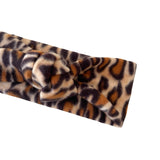 Leopard print headband on a white background