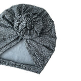 Leopard print headscarf with a gray interior on a white background