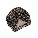 Leopard print headscarf on a white background