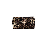 A leopard print clutch bag with a knotted front detail, shown against a plain white background.