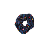 Blue scrunchie with colorful patterns on a white background