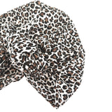 Leopard print headscarf with a knot on a white background