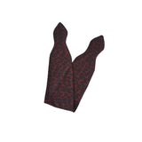 Black and red patterned bow tie on a white background