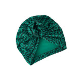 Green leopard print headscarf on a white background