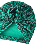Green leopard print headscarf on a white background