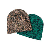 Two patterned beanies, one with leopard print and the other with green and black design, on a white background.