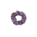 Purple scrunchie on a white background