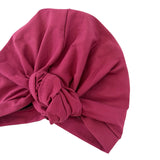 Pink headscarf with a knot on a white background