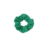 Green scrunchie on a white background