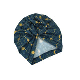 Blue headscarf with gold moon and star pattern on a white background