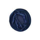 Navy blue velvet beret on a white background