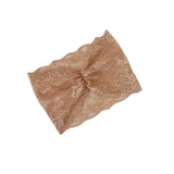 Beige lace fabric on a white background