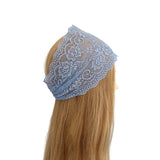 Blue lace headband on a mannequin head with blonde hair against a white background