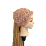 Mannequin head with a beige lace hijab and long blonde hair on a white background