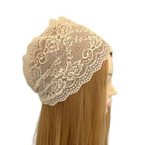 Beige lace headband on a mannequin head with long blonde hair against a white background