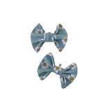 Two floral-patterned  bows on a white background