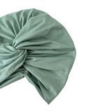 Sage green headscarf with a knot on a white background