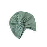 Green headscarf on a white background