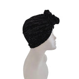 Black textured head wrap on a mannequin head against a white background