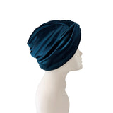 Blue headscarf on a mannequin head against a white background