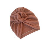 Brown ribbed turban with a knot on a white background